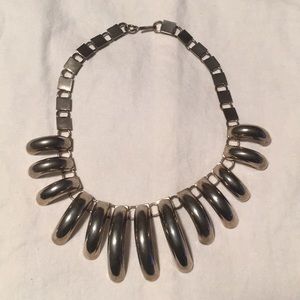 Bold silver fashion necklace with curl drops